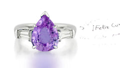 279 custom made unique pear shaped purple sapphire center stone and baguette diamond accent three stone engagement ring