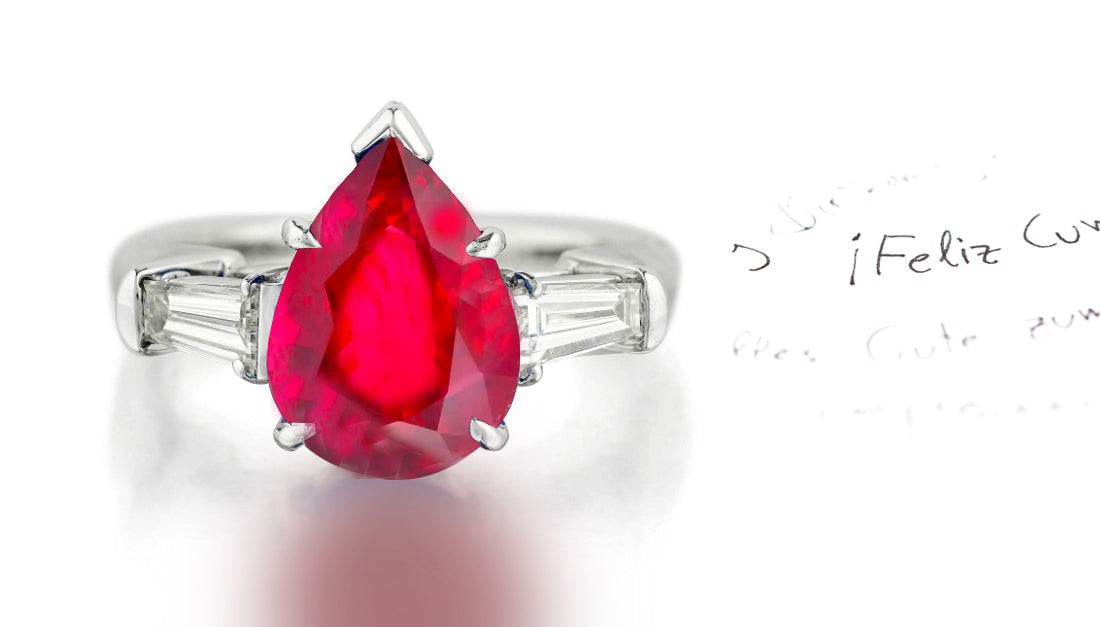 279 custom made unique pear shaped ruby center stone and baguette diamond accent three stone engagement ring