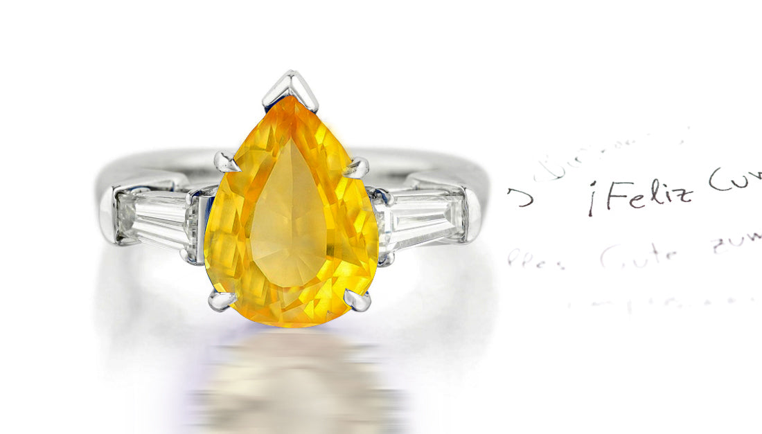 279 custom made unique pear shaped yellow sapphire center stone and baguette diamond accent three stone engagement ring