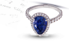 29 custom made unique pear blue sapphire center stone with diamond halo and side diamond accents engagement ring