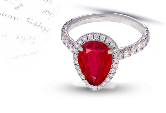 29 custom made unique pear ruby center stone with diamond halo and side diamond accents engagement ring