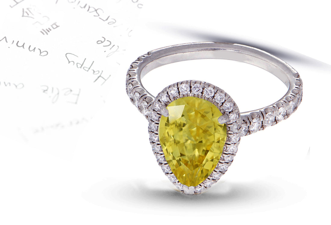 29 custom made unique pear yellow sapphire center stone with diamond halo and side diamond accents engagement ring