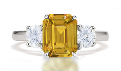 290 custom made unique emerald cut yellow sapphire center stone and round diamond accent three stone engagement ring