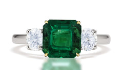 291 custom made unique square emerald center stone and round diamond accent three stone engagement ring