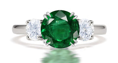 292 custom made unique round emerald center stone and round diamond accent three stone engagement ring