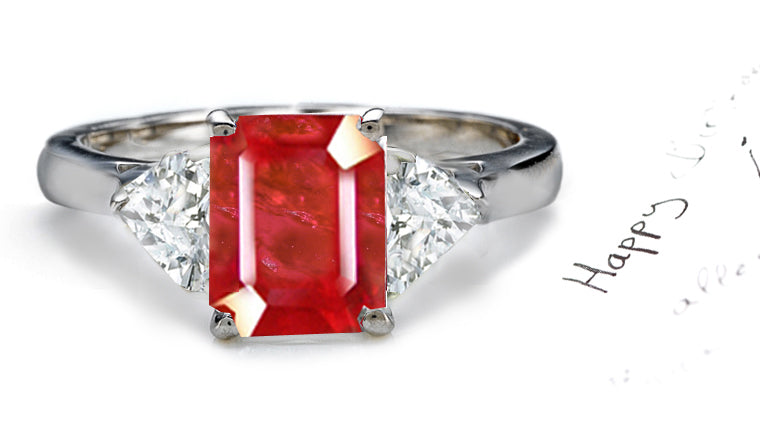 engagement ring three stone with emerald cut ruby centers and side pear shaped diamonds