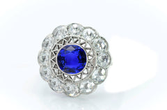 3 custom made blue sapphire and diamond flower halo engagement rings