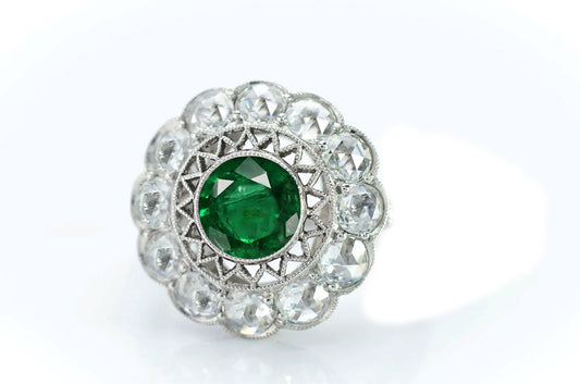 3 custom made emerald and diamond flower halo engagement rings