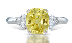 3 custom made unique cushion cut yellow sapphire center stone with heart diamond accents three stone engagement ring