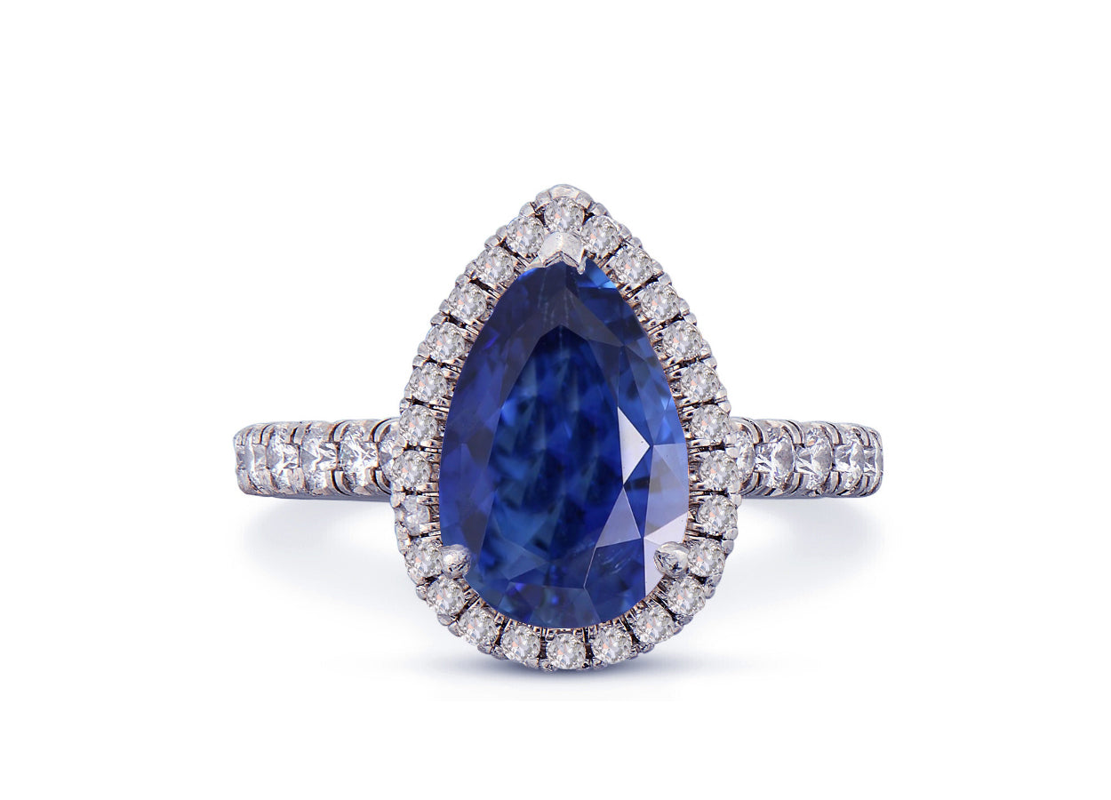 29 custom made unique pear blue sapphire center stone with diamond halo and side diamond accents engagement ring