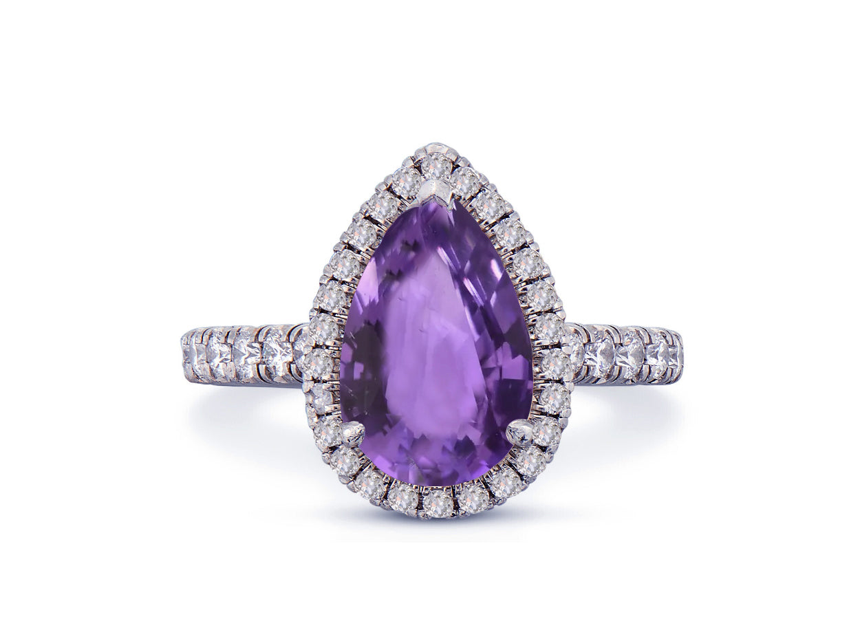 29 custom made unique pear purple sapphire center stone with diamond halo and side diamond accents engagement ring