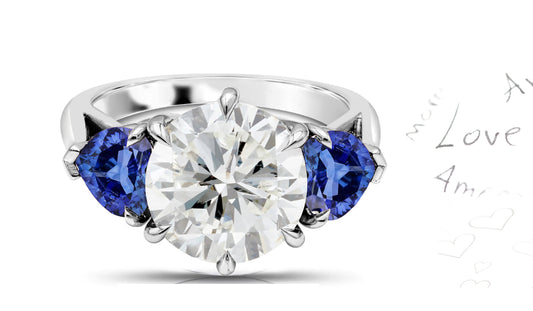 301 custom made unique round diamond center stone and heart blue sapphire accent three stone engagement ring