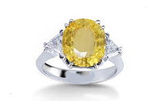 304 custom made unique oval yellow sapphire center stone and trillion diamond accent three stone engagement ring