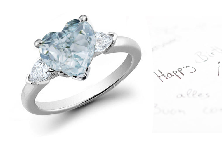 engagement ring three stone with blue diamond heart center and side pear white diamonds