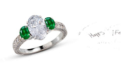 305 custom made unique oval diamond center stone and oval emerald accent three stone engagement ring