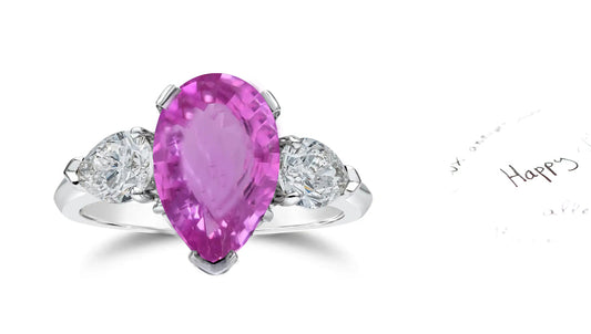 307 custom made unique pears pink sapphire center stone and pears diamond accent three stone engagement ring