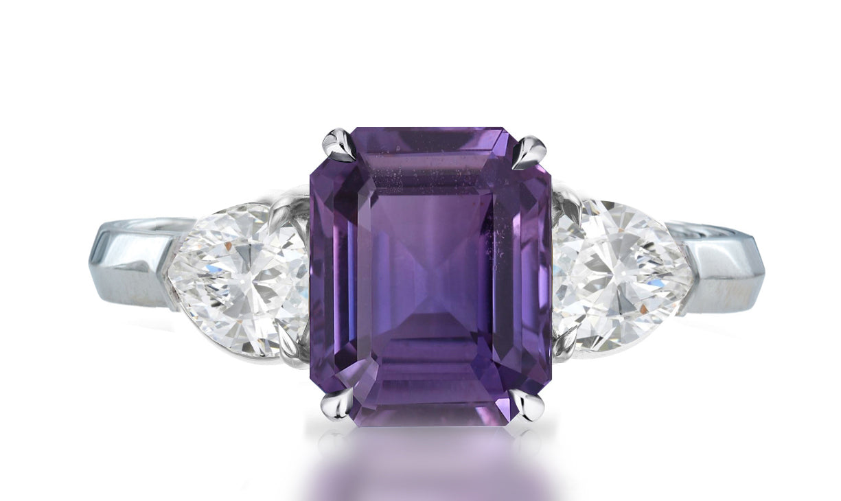 33 custom made unique emerald cut purple sapphire center stone with pear diamond accents three stone engagement ring