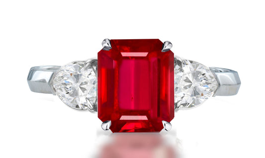 33 custom made unique emerald cut ruby center stone with pear diamond accents three stone engagement ring