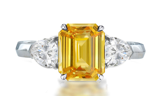 33 custom made unique emerald cut yellow sapphire center stone with pear diamond accents three stone engagement ring