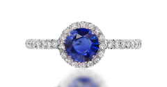 39 custom made unique round blue sapphire center stone with intricate diamond accent halo engagement ring