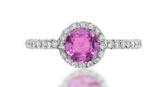 39 custom made unique round pink sapphire center stone with intricate diamond accent halo engagement ring