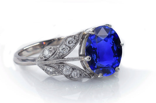 4 custom made blue sapphire and diamond flower halo engagement rings