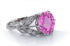 4 custom made pink sapphire and diamond flower halo engagement rings