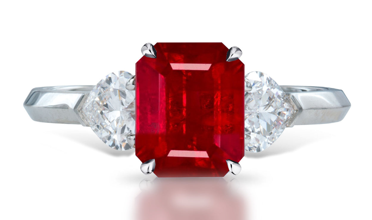 4 custom made unique emerald cut ruby center stone with heart diamond accents three stone engagement ring