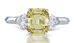 4 custom made unique emerald cut yellow sapphire center stone with heart diamond accents three stone engagement ring