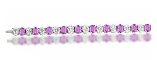 4 custom unique alternating oval pink sapphire and diamond tennis bracelet.