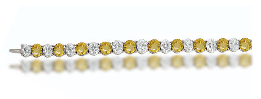 4 custom unique alternating oval yellow sapphire and diamond tennis bracelet.