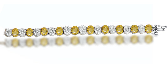 4 custom unique alternating oval yellow sapphire and diamond tennis bracelet.