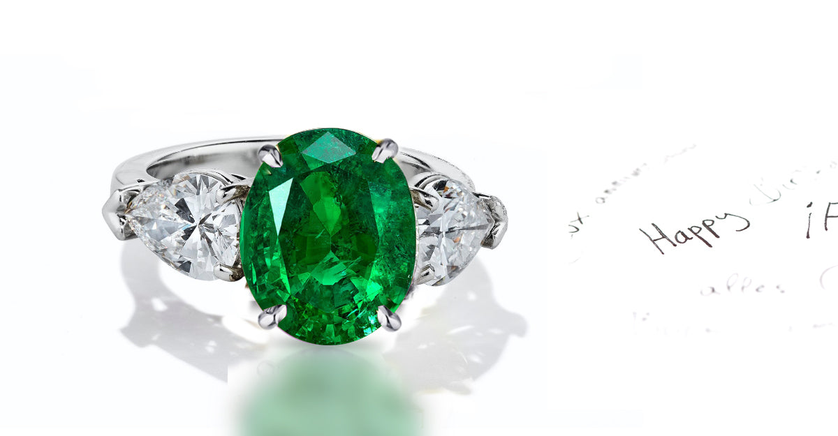 42 custom made unique oval emerald center stone with pear diamond accents three stone engagement ring