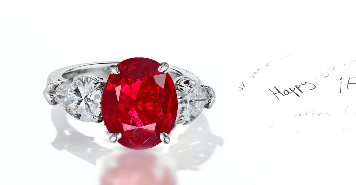 42 custom made unique oval ruby center stone with pear diamond accents three stone engagement ring