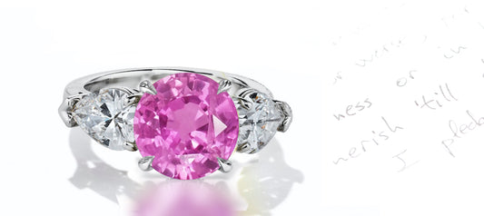 43 custom made unique round pink sapphire center stone with pear diamond accents three stone engagement ring