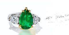 45 custom made unique pear emerald center stone with pear diamond accents three stone engagement ring