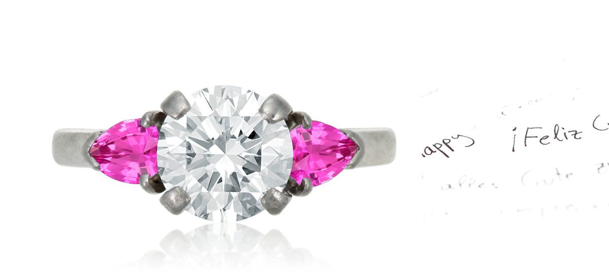 47 custom made unique round diamond center stone with pear pink sapphire accents three stone engagement ring