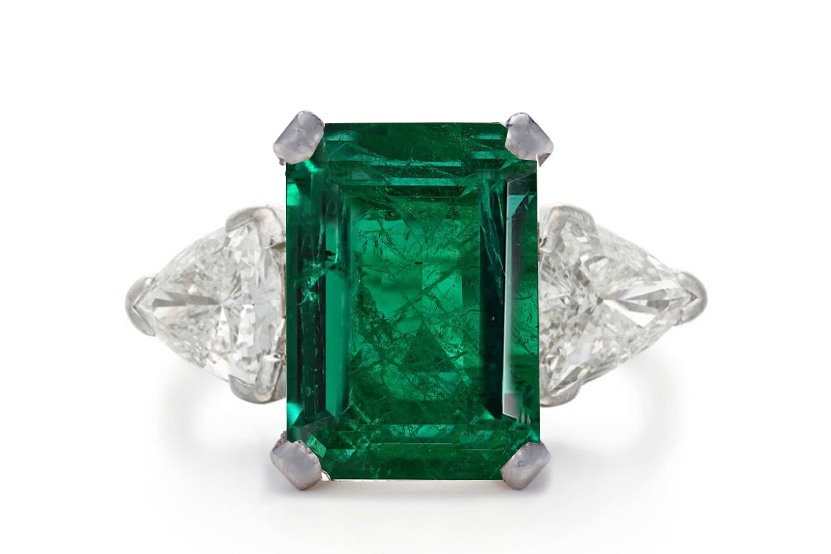 500 custom made unique emerald cut emerald center stone and trillion diamond accents three stone engagement ring