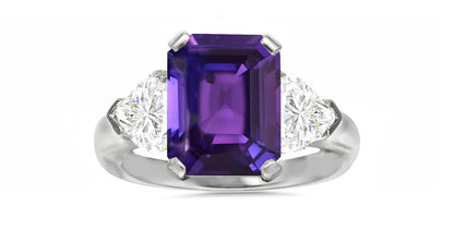 127 custom made unique emerald cut purple sapphire center stone and heart diamond side three stone engagement ring