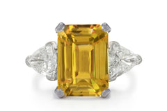 500 custom made unique emerald cut yellow sapphire center stone and trillion diamond accents three stone engagement ring