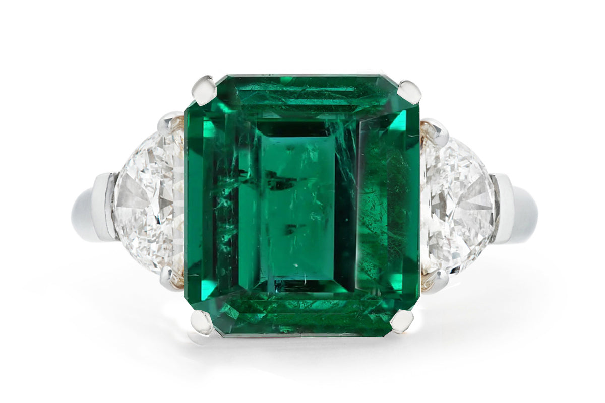 502 custom made unique emerald cut emerald center stone and half moon diamond accents three stone engagement ring