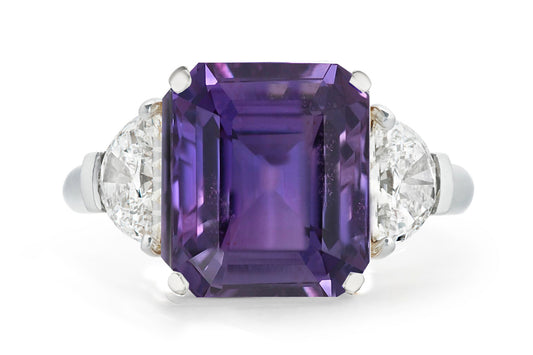 502 custom made unique emerald cut purple sapphire center stone and half moon diamond accents three stone engagement ring