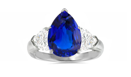 502 custom made unique pear blue sapphire center and heart diamond accents three stone engagement ring