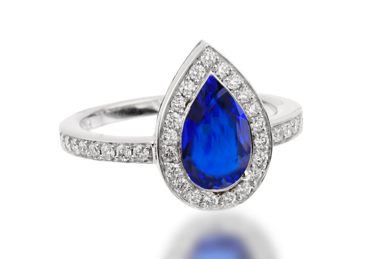 503 custom made unique pear blue sapphire center stone and diamond halo engagement ring