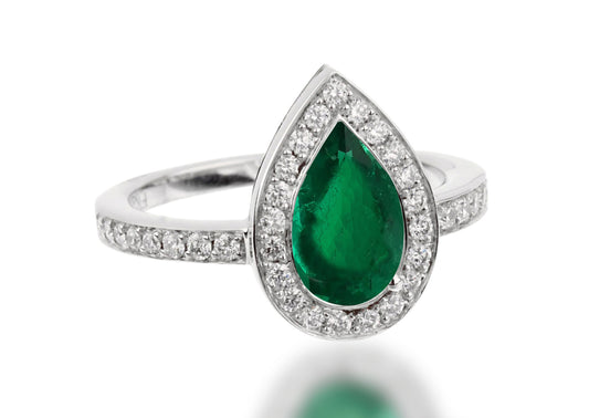 503 custom made unique pear emerald center stone and diamond halo engagement ring