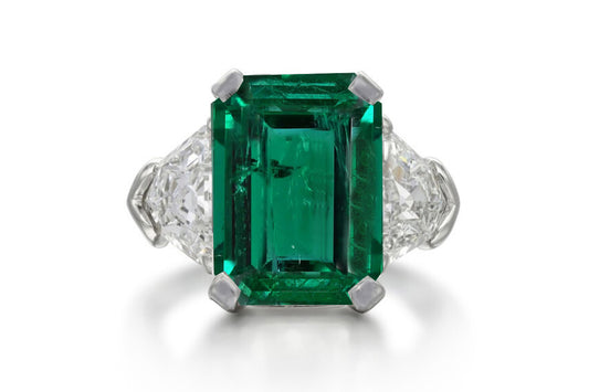 504 custom made unique emerald cut emerald center stone and fancy diamond accents three stone engagement ring