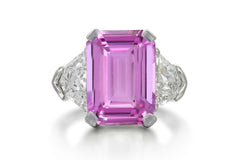 504 custom made unique emerald cut pink sapphire center stone and fancy diamond accents three stone engagement ring