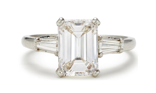 505 custom made unique emerald cut diamond center stone and baguette diamond accents three stone engagement ring