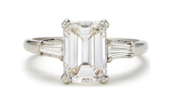 505 custom made unique emerald cut diamond center stone and baguette diamond accents three stone engagement ring