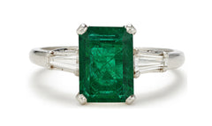 505 custom made unique emerald cut emerald center stone and baguette diamond accents three stone engagement ring